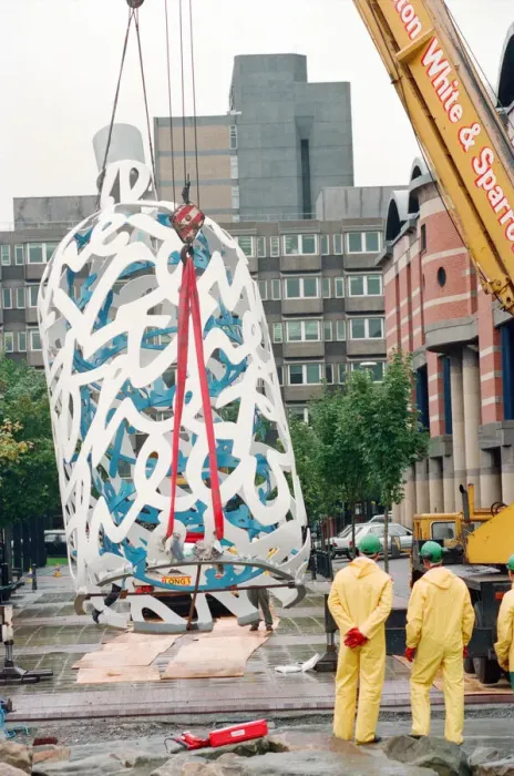 Framed Print : The sculpture Bottle of Notes is lifted off its low loader in the Central