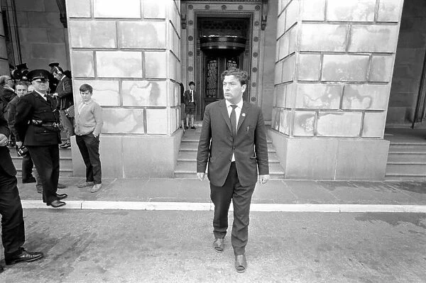 SDLP politician John Hume leaves the Stormont building in Belfast