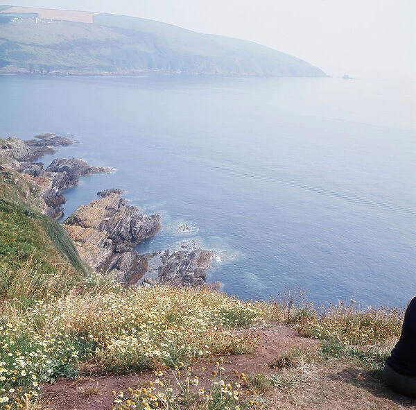 The sea over rocks between Looe and Polperro, Cornwall. 1973