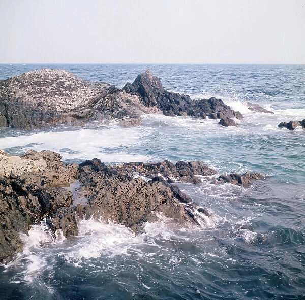 Sea over the rocks outside Polperro, Cornwall. 1973