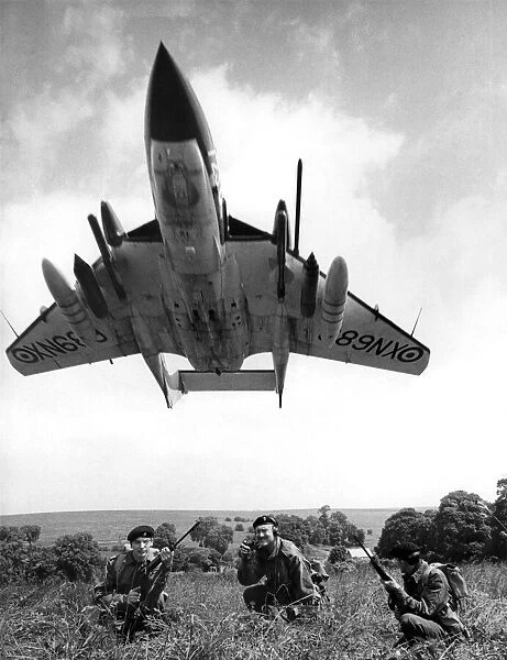 A Sea Vixen swoops over soldiers seen here on exercise on Salisbury Plain
