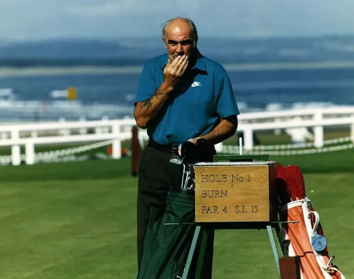 Framed Print : Sean Connery at first hole St Andrews golf course hand on moustache golf bag clubs