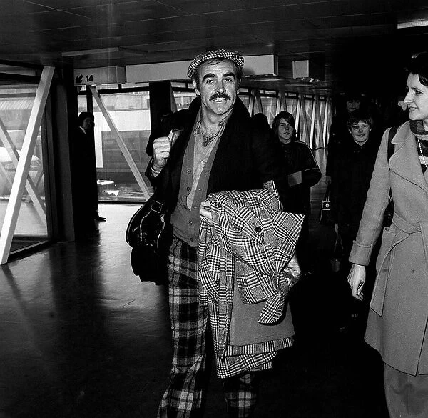 Sean Connery leaving Heathrow airport for Oslo where he is to play the part of an airport