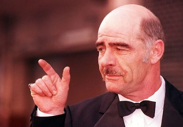 Sean Connery lookalike February 1198 John Garland wearing bow tie pointing finger