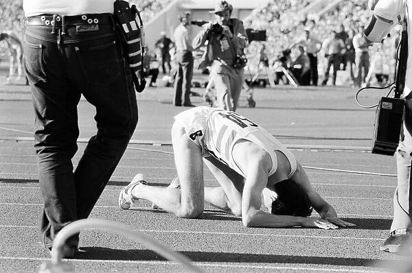 Sebastian Coe collapses to the ground with relief after winning the Mens 1500 metres