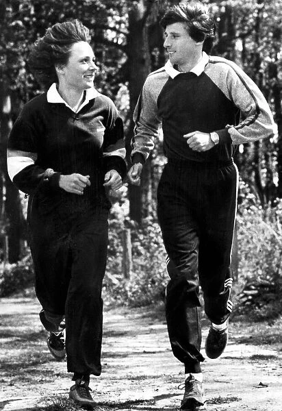 Sebastian Coe and friend running along forest trail during training - May 1982