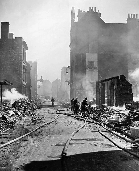 Second World War, Canterbury. Part of the main street. Firemen putting out