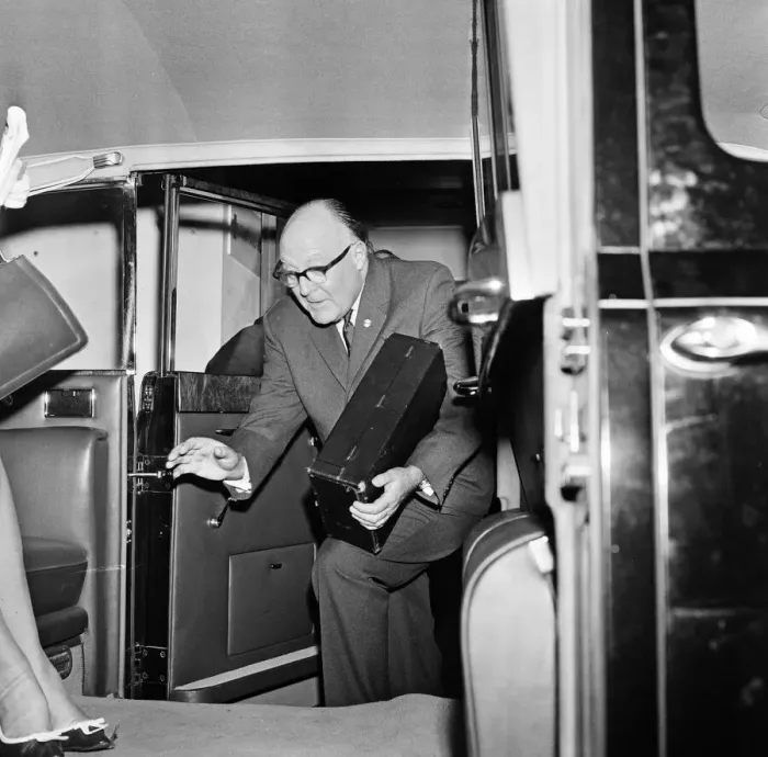 Framed Print : Secretary of the Football Association Denis Follows carries the Jules Rimet trophy inside