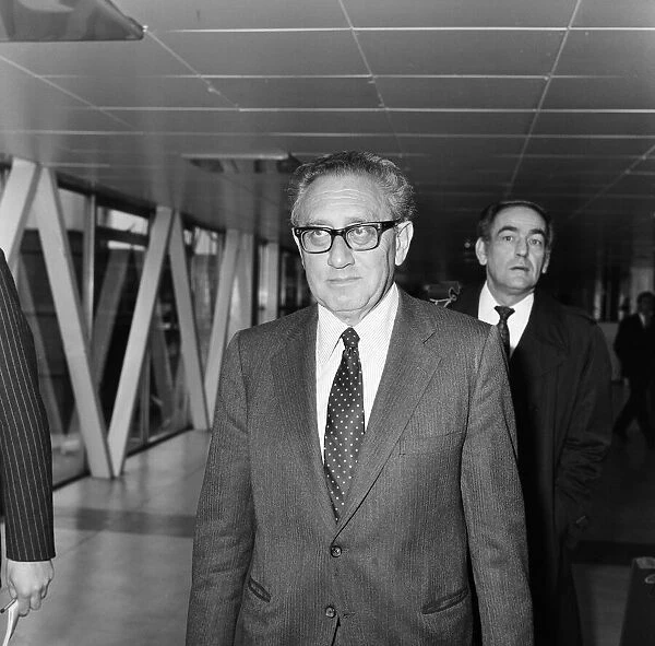 Former US Secretary of State, Henry Kissinger, leaving London airport to fly to New York