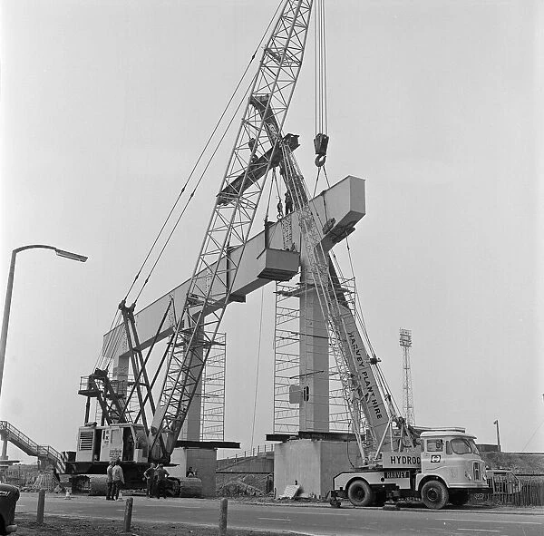 Section of A19 is lifted into position, Middlesbrough, Circa 1973. Harvey Plant Hire