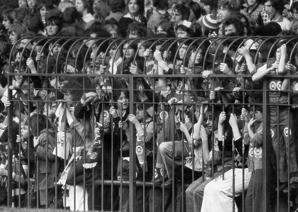 A section of the caged fans at the Stretford End of Old Trafford watching the match