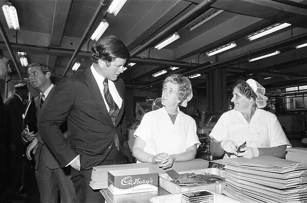 Senator Edward Kennedy seen here chatting to two of the Cadbury work force during his