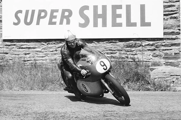 Senior TT race, Isle of Man. Mike Hailwood in action. 8th June 1964