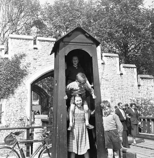 When the sentry is away the children will play. Children visiting The Tower of London