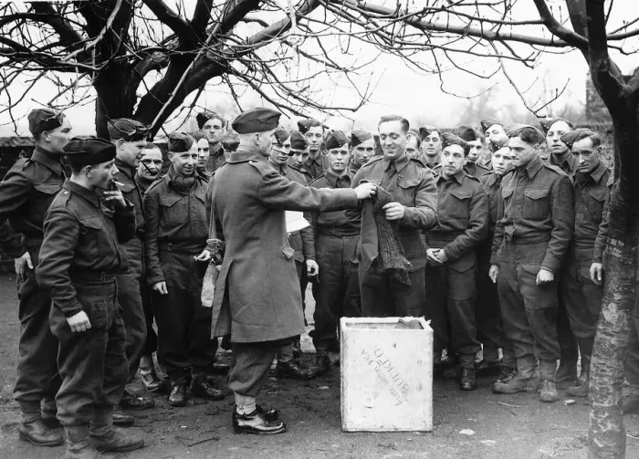 Framed Print : Sergeant Major issuing comforts to soldiers of the Suffolk Regiment Framed Print : Sergeant Major issuing comforts to soldiers of the Suffolk Regiment