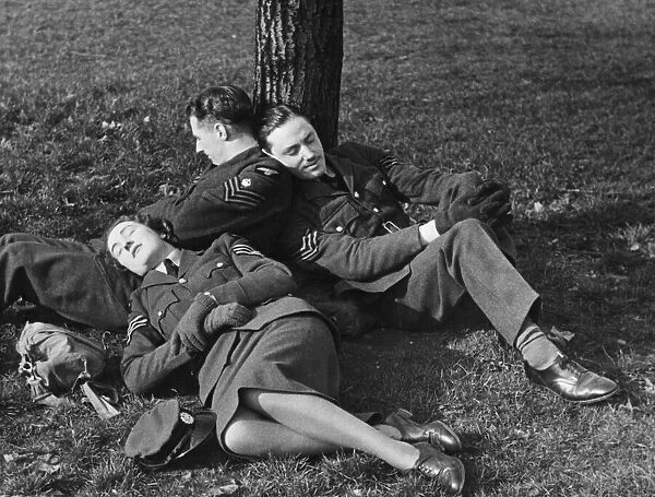 Sergeants siesta in Hyde Park, London during World War II. 14th April 1941