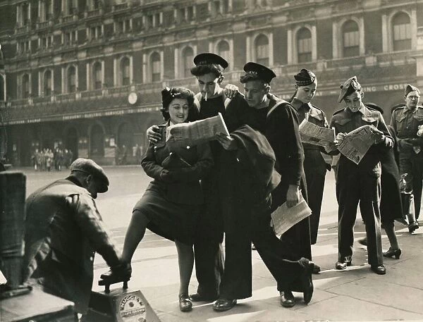 Service personal men and women lining up for shoe shine at Charing Cross Station, London