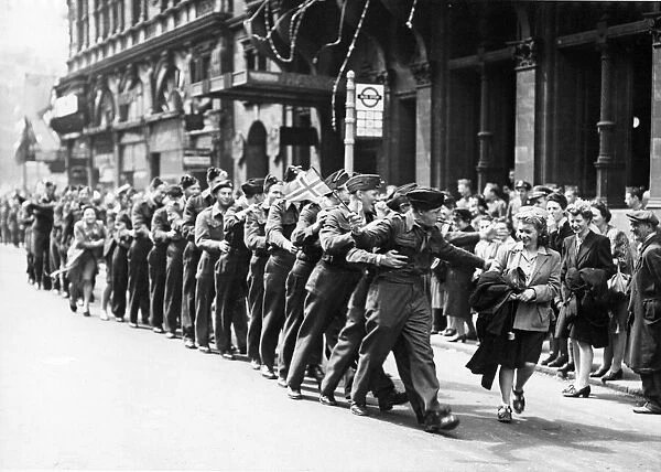 Serviceman in Piccadilly, London, shortly after VE Day. The celebrations for end of