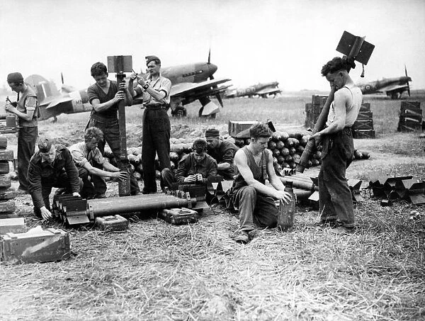 Servicing commandos of the RAF have a busy time on the Normandy airfields assembling