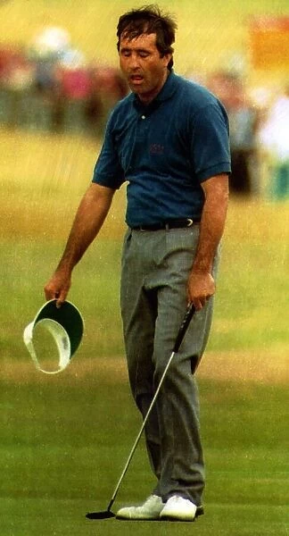 Seve Ballesteros sneezing on the golf course holding a cap and a club circa 1998