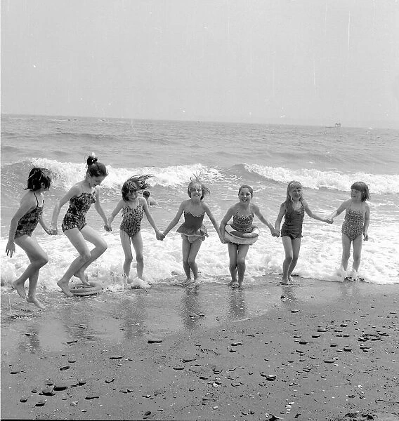 Seven little girls on Paignton beach June 1963