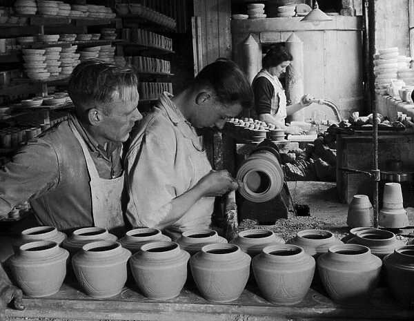 Seventeen year old Len Mills, apprenticed turner of teapots