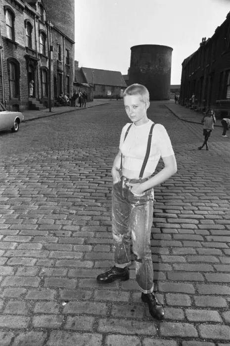 Framed Print : Seventeen year old skinhead teenager Janet Askham poses in the street at her home in Framed Print : Seventeen year old skinhead teenager Janet Askham poses in the street at her home in