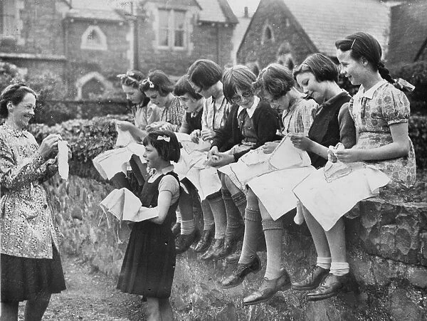 A sewing lesson in the school playground at Llanfairfechan, Conwy County Borough, Wales