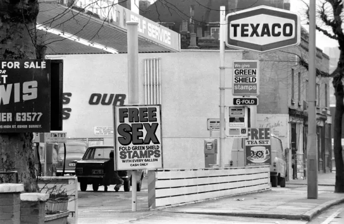 Framed Print : Sex'Garage Sign. In a bid to get business in the Easter Petrol War
