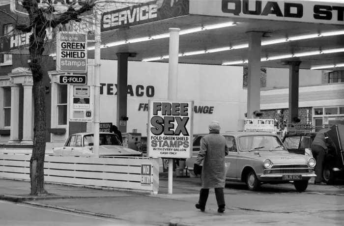 Framed Print : Sex'Garage Sign. In a bid to get business in the Easter Petrol War