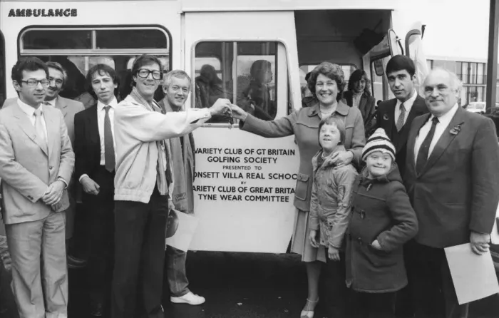 Framed Print : The Shadowss Hank Marvin at the bus handover to Villa Real School headteacher Elsie Framed Print : The Shadowss Hank Marvin at the bus handover to Villa Real School headteacher Elsie