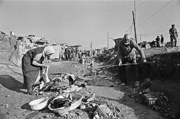 Shanty town on the eastern edge of Tehran, where open sewers run past houses made of mud