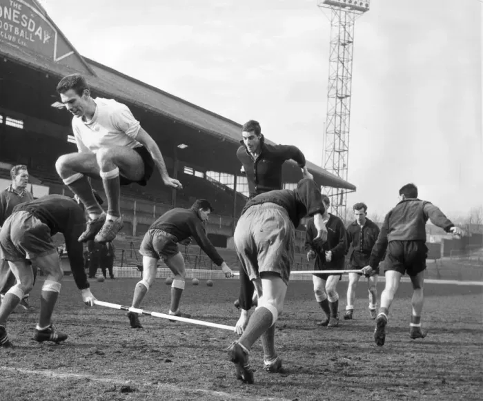 Framed Print : Sheffield Wednesday football players pictured jumping over poles during a training