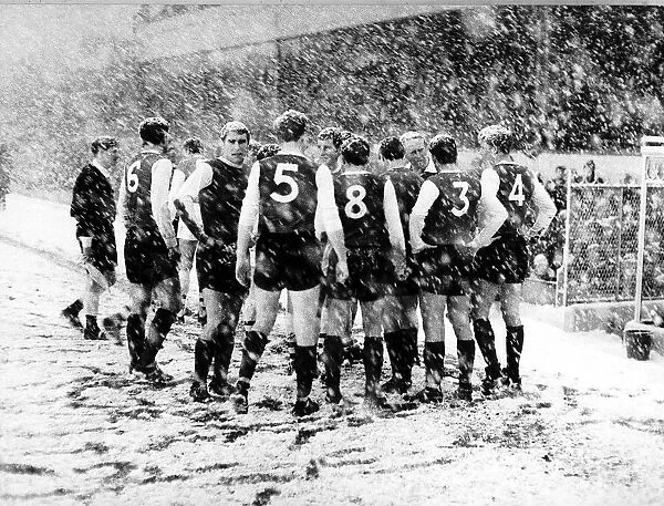 Sheffield Wednesday players gather on the side line at Highbury during their match