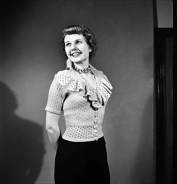 Sheila Sim is wearing frilly Jarnpon Blouse. February 1952 C6324