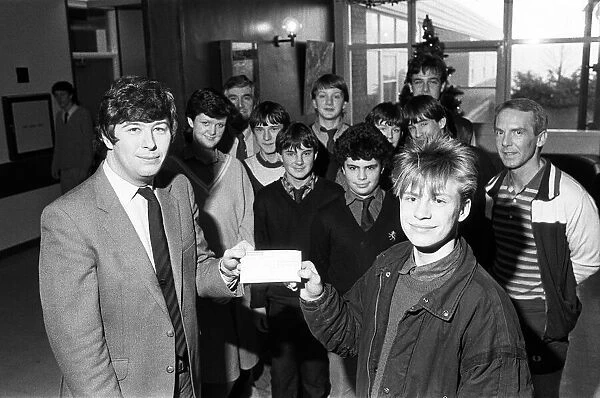 Shelley High School and Sixth form pupils present cheque of 115 to Graeme Staniforth of