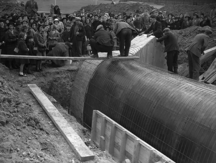 Framed Print : Shelters for Schools. Parents watch the construction of one of the air raid shelters Framed Print : Shelters for Schools. Parents watch the construction of one of the air raid shelters