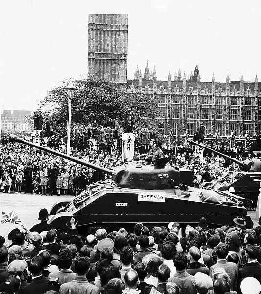 A Sherman tank passes the Palace of Westminster London during WW2 Peace Parade June