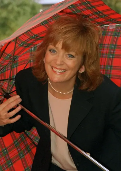Framed Print : Sherrie Hewson cornation St actress holding a tartan umbrella Framed Print : Sherrie Hewson cornation St actress holding a tartan umbrella