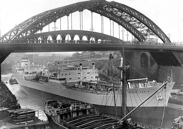 The Ship Hoegh Eagle moves up the River Wear under the Wearmouth Bridge in Sunderland