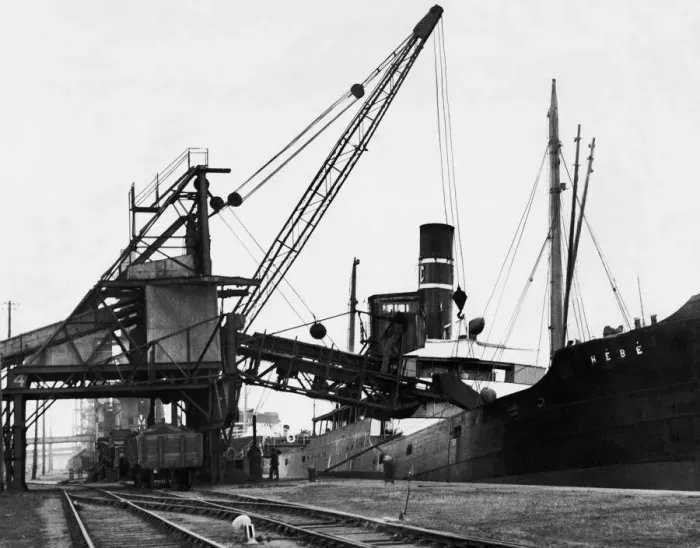 Framed Print : A ship loading anthracite coal by conveyor at the Swansea docks. Circa January 1937