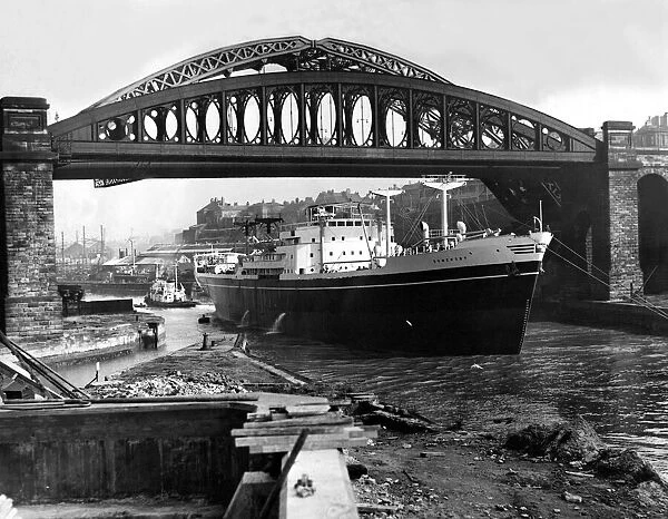 The ship Somersby passes under the Monkwearmouth Bridge on the River Wear at Sunderland