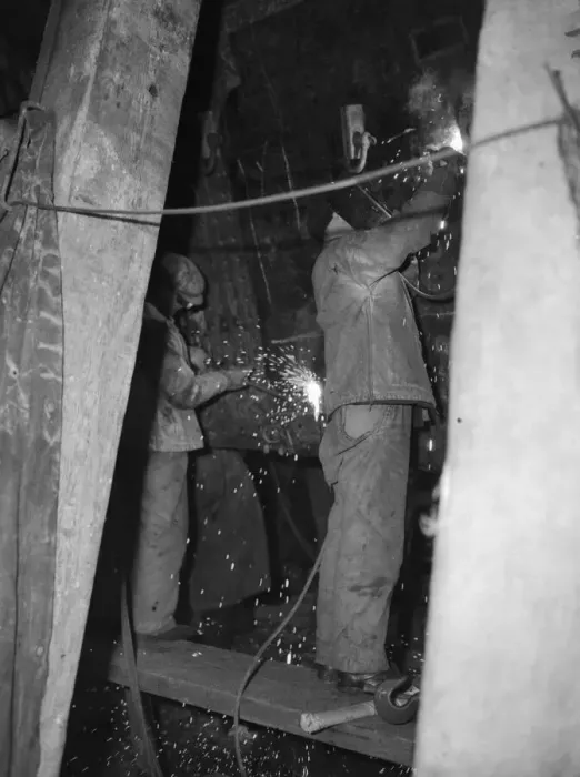 Framed Print : Shipbuilders at the King George V dry dock in Southampton replace damaged hull plates of Framed Print : Shipbuilders at the King George V dry dock in Southampton replace damaged hull plates of