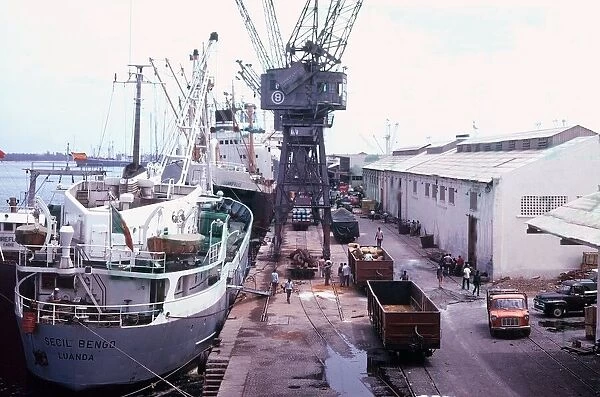 Ships being loaded and unloaded at the port of Luanda in Angola, Africa Circa 1970