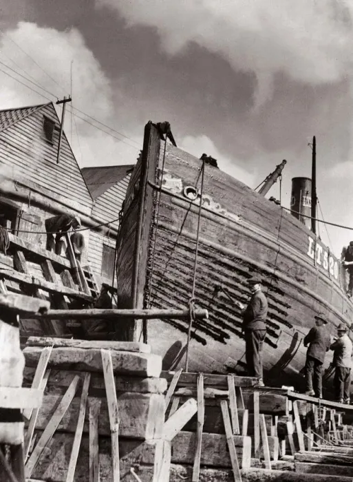 Framed Print : Shipyard workers re caulking a Lowestoft herring boat on stocks in dry dock Circa Framed Print : Shipyard workers re caulking a Lowestoft herring boat on stocks in dry dock Circa