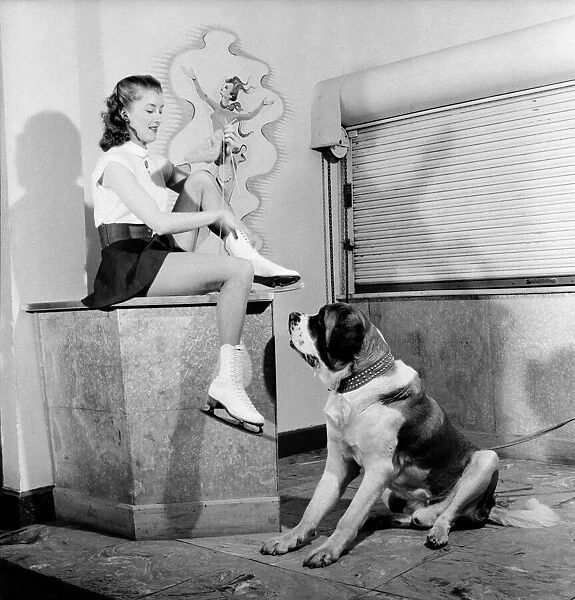 Shirley Birke Ice skater seen here with her dog. May 1953 D2397