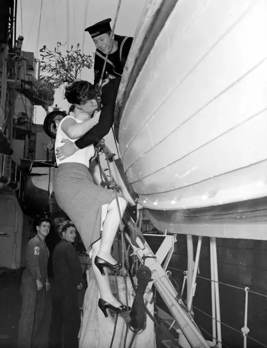 Framed Print : Shirley Cross aged 20 of Plymouth climbs a rope ladder to kiss sailor ME Dick Kemish Framed Print : Shirley Cross aged 20 of Plymouth climbs a rope ladder to kiss sailor ME Dick Kemish
