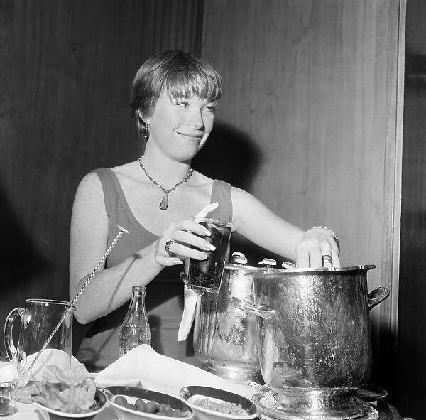 Shirley MacLaine, pictured enjoying a glass of coke in her room at Claridge