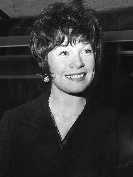 Shirley MacLaine smiling at London Airport - December 1964