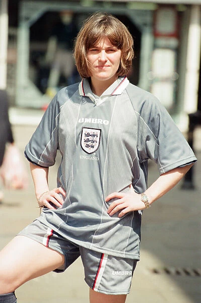 Shop asistant Karen Burke from Soccer City, models Englands Grey Strip, Liverpool